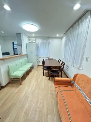 a living room with a table and chairs and a couch at GreatViewHouse - Vacation STAY 19425 in Tokyo