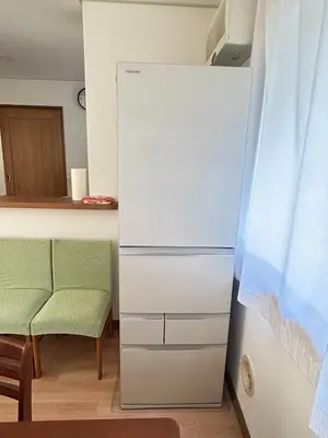 a white refrigerator in a kitchen with a chair at GreatViewHouse - Vacation STAY 19425 in Tokyo