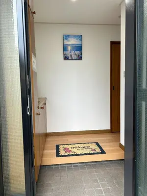 a hallway with a door to a room with a rug at GreatViewHouse - Vacation STAY 19425 in Tokyo