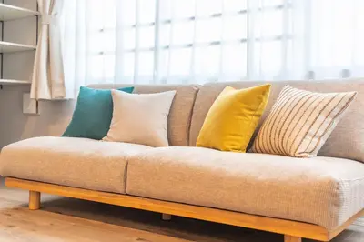 a couch with pillows on it in a living room at Improve Nishi Magome - Vacation STAY 19513 in Tokyo