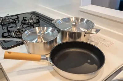 two pots and pans sitting on top of a stove at Improve Nishi Magome - Vacation STAY 19513 in Tokyo