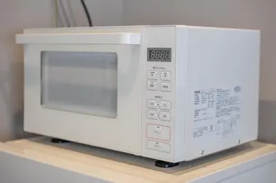 a microwave oven sitting on top of a shelf at Improve Nishi Magome - Vacation STAY 19541 in Tokyo