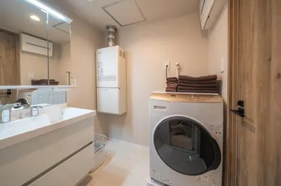 a washing machine in a bathroom next to a sink at Improve Nishi Magome - Vacation STAY 19541 in Tokyo