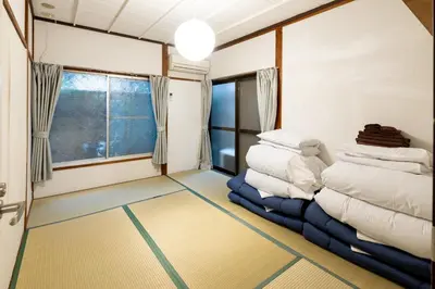 a room with a pile of pillows on the floor at Nakaitabashi Kotate - Vacation STAY 19730 in Tokyo