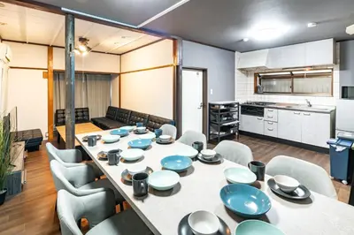 a room with a table and chairs and a kitchen at Nakaitabashi Kotate - Vacation STAY 19730 in Tokyo