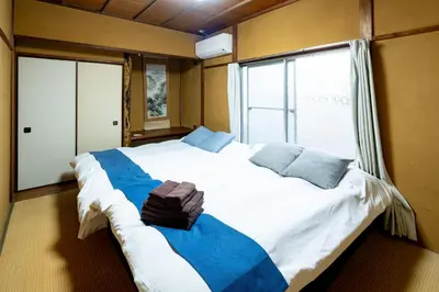 a large white bed in a room with a window at Nakaitabashi Kotate - Vacation STAY 19730 in Tokyo