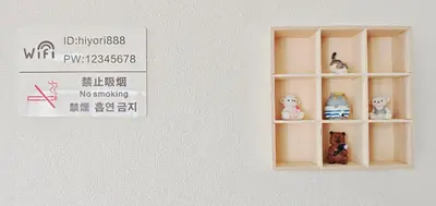 a white shelf with toys on it next to a sign at SkyTree-501 in Tokyo