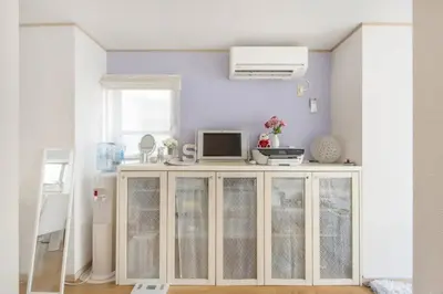 a room with a cabinet with a tv on it at Yoyogi Detached house Y4BD in Tokyo