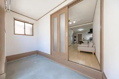 an empty living room with a sliding glass door at Bnn\u5800\u52072\u4e01\u76eeESTA III in Tokyo