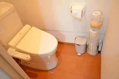 a bathroom with a white toilet in a room at \u677e\u8f1d\u65c5\u9928 in Tokyo