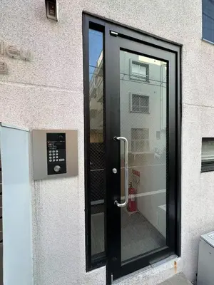 a black door with a window on the side of a building at Horizon Bleu Asakusa202 in Tokyo