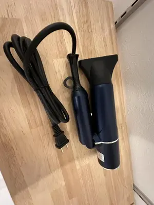 a black umbrella sitting on top of a wooden table at Horizon Bleu Asakusa202 in Tokyo