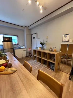 a kitchen and dining room with a table and chairs at Takashi Vada Home in Tokyo