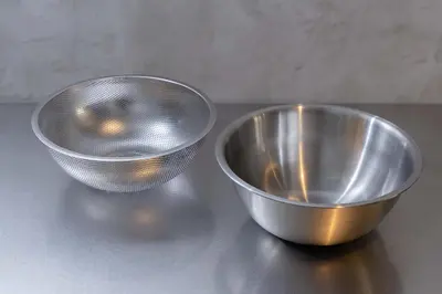 two metal bowls sitting on top of a counter at Hotel Numero dix in Tokyo
