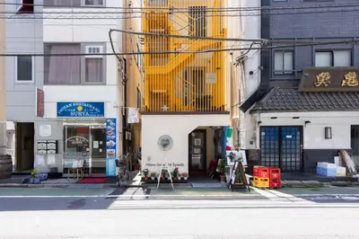 a city street with buildings on the side of the road at Hotel Numero dix in Tokyo
