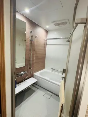 a bathroom with a bath tub and a shower at AhaiHotel in Wada