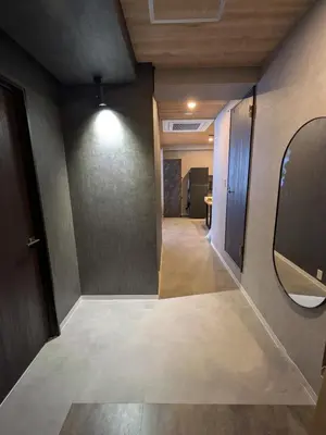 a hallway with a mirror and a hallway with a hallway at Hotel iemirai Araiyakushi - Shinjuku 9min train ride in Tokyo