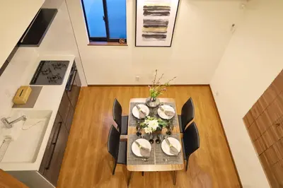 a dining room with a table and chairs at \u6c60\u888b4\u4e01\u76ee\u8cb8\u5207\u4e00\u8ed2\u5bb6\u6700\u5927\u4e03\u540d in Tokyo