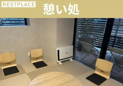 a room with two chairs and a tv and a table at Sugoi Sauna And Stay Azabu-Juban Station, Men Only in Tokyo