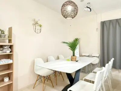 a white dining room with a white table and white chairs at \u5c71\u624b\u7dda\u5927\u585a\u99c5 family land 4LDK in Tokyo