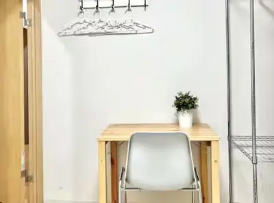 a chair sitting at a table with a desk with a chair at \u5c71\u624b\u7dda\u5927\u585a\u99c5 family land 4LDK in Tokyo