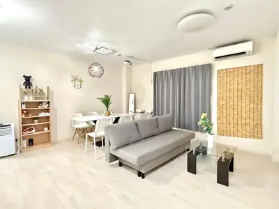 a living room with a couch and a table at \u5c71\u624b\u7dda\u5927\u585a\u99c5 family land 4LDK in Tokyo