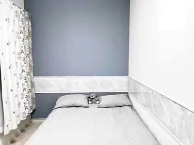 a bed with two pillows and a teddy bear on it at \u5c71\u624b\u7dda\u5927\u585a\u99c5 family land 4LDK in Tokyo