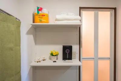 a shelf in a bathroom with a shower at \u56db\u5b63\u5b89\u3005 in Tokyo