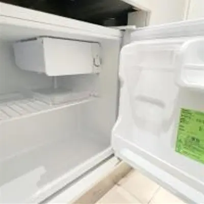 an empty refrigerator with its door open with its door at AAo HalfSea in Tokyo