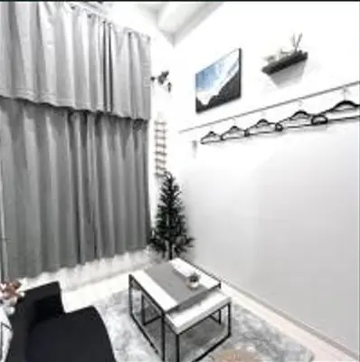 a living room with a couch and a table at AYooci o7 in Tokyo