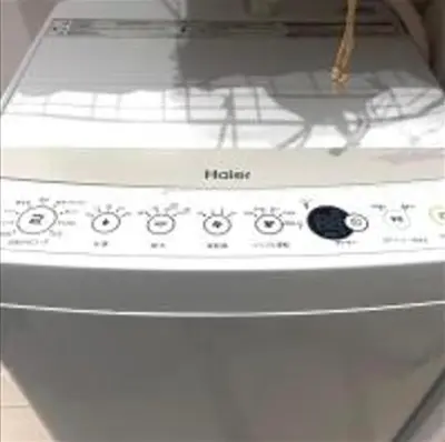 a white stove top oven with a microwave at AYooci o7 in Tokyo