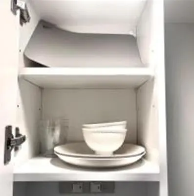 a plate and a bowl on a shelf in a cabinet at AYooci o7 in Tokyo