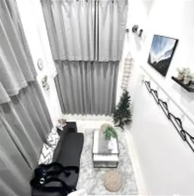 a small living room with a couch and a table at AYooci o7 in Tokyo