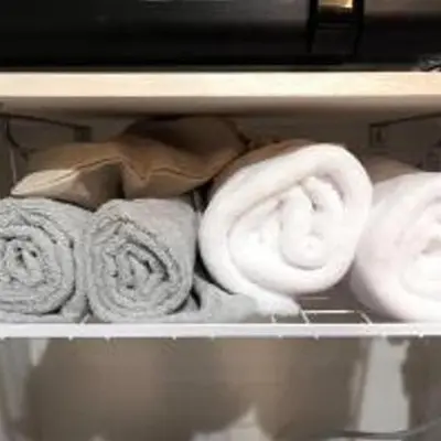 a bunch of towels are sitting on a shelf at \u3072\u3060\u307e\u308a One in Tokyo