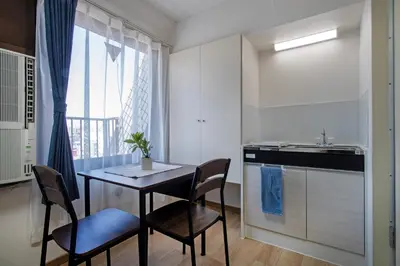 a kitchen with a table and chairs and a sink at CraftFlat Komagome Family 6 in Tokyo