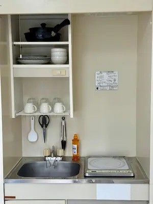 a kitchen with a sink and a counter top at \u3059\u304c\u3082\u5c0f\u5bbf in Tokyo