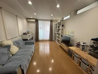a living room with a couch and a television at Ikebukuro\u6c60\u888b1stop-2min-Kitaikebukuro\u5317\u6c60\u888bwalk3min in Tokyo