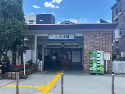 a gas station with a man standing outside of it at Ikebukuro\u6c60\u888b1stop-2min-Kitaikebukuro\u5317\u6c60\u888bwalk3min in Tokyo