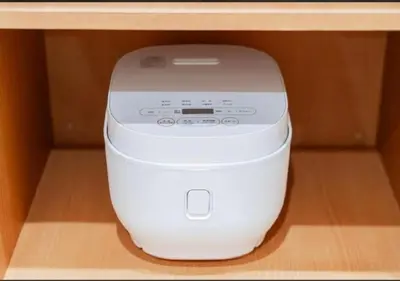 a white computer sitting on top of a shelf at Oshiage SAIEI Hotel 101 in Tokyo