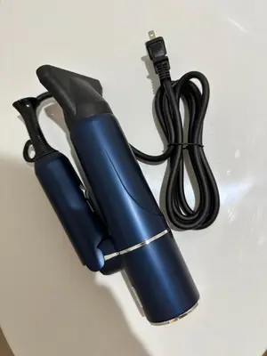 a blue flashlight sitting on a white table at The Birth 501 in Tokyo