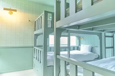 a couple of bunk beds in a room at Q-ROOMS Harajuku in Tokyo