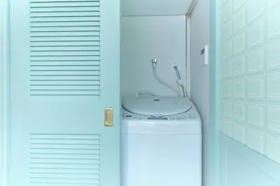 a bathroom with a white toilet in a room at Q-ROOMS Harajuku in Tokyo