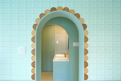 a bathroom with a sink and a mirror at Q-ROOMS Harajuku in Tokyo