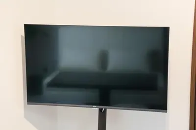 a flat screen tv hanging on a wall at Grazia\u5c0f\u5ca9 201 in Tokyo