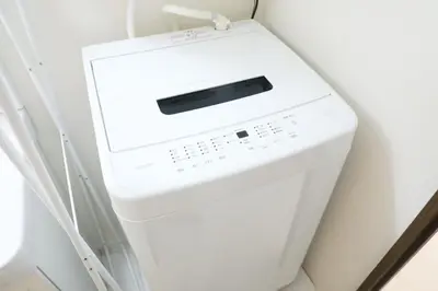 a white washer and dryer in a room at Grazia\u5c0f\u5ca9 201 in Tokyo