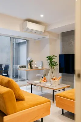 a living room with a couch and a tv at \u5143\u9ebb\u5e03\u30ec\u30b8\u30c7\u30f3\u30b9106 Sakura in Tokyo