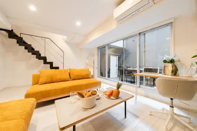 a living room with a couch and a table at \u5143\u9ebb\u5e03\u30ec\u30b8\u30c7\u30f3\u30b9106 Sakura in Tokyo