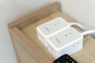 two wii remotes sitting on a table with a remote control at Gold HOTEL SHIBUYA in Tokyo