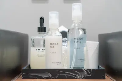 a group of bottles sitting on top of a table at Gold HOTEL SHIBUYA in Tokyo