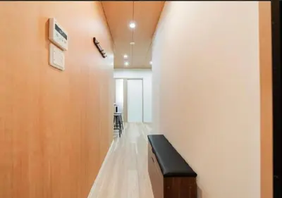 a hallway with a bench in a room at Oshiage SAIEI Hotel 301 in Tokyo